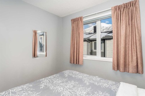140-1202 Bow Valley Trail, Canmore, AB - Indoor Photo Showing Bedroom