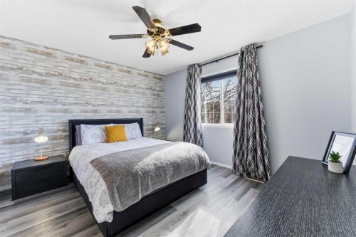 84 Mt Apex Green Se, Calgary, AB - Indoor Photo Showing Bedroom