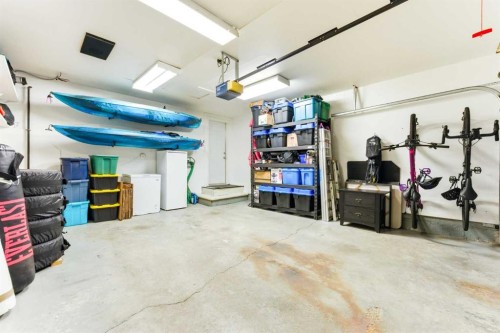 84 Mt Apex Green Se, Calgary, AB - Indoor Photo Showing Garage