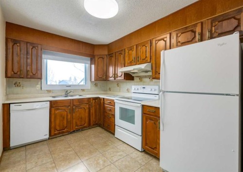 60 Macewan Glen Drive Nw, Calgary, AB - Indoor Photo Showing Kitchen With Double Sink