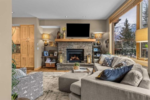 22 Streamside Lane, Canmore, AB - Indoor Photo Showing Living Room With Fireplace