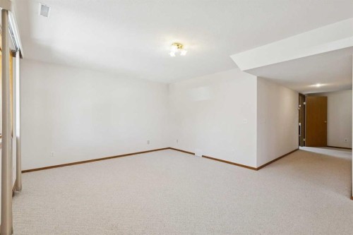 135 Sceptre Close Nw, Calgary, AB - Indoor Photo Showing Other Room