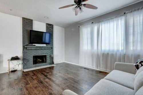 35 Penworth Place Se, Calgary, AB - Indoor Photo Showing Living Room With Fireplace