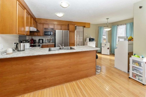 63 Hawkmount Green Nw, Calgary, AB - Indoor Photo Showing Kitchen With Double Sink