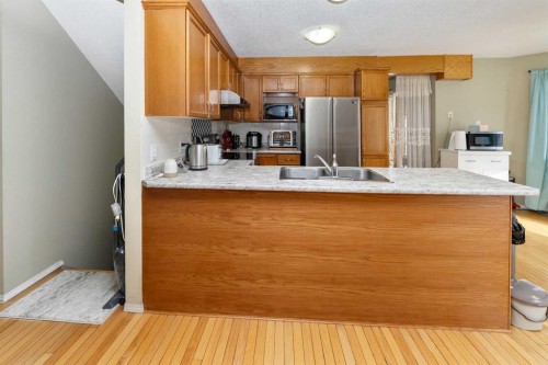 63 Hawkmount Green Nw, Calgary, AB - Indoor Photo Showing Kitchen With Double Sink