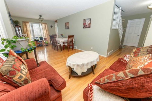 63 Hawkmount Green Nw, Calgary, AB - Indoor Photo Showing Living Room