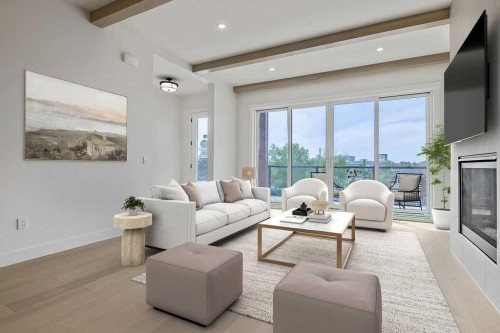 712 Bridge Crescent Ne, Calgary, AB - Indoor Photo Showing Living Room With Fireplace