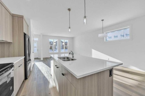 1115 Chinook Winds Circle Sw, Airdrie, AB - Indoor Photo Showing Kitchen With Double Sink With Upgraded Kitchen