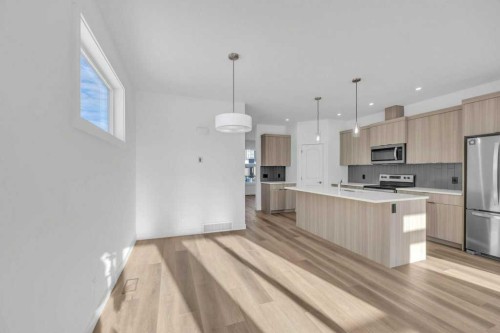 1115 Chinook Winds Circle Sw, Airdrie, AB - Indoor Photo Showing Kitchen With Stainless Steel Kitchen