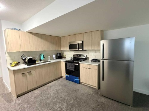 1115 Chinook Winds Circle Sw, Airdrie, AB - Indoor Photo Showing Kitchen With Stainless Steel Kitchen