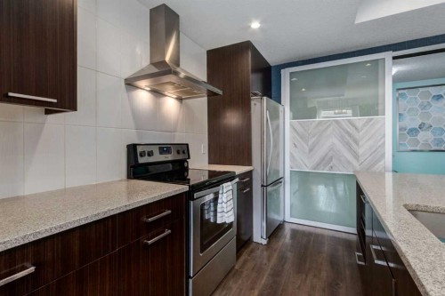 415 Saddlemont Boulevard Ne, Calgary, AB - Indoor Photo Showing Kitchen With Upgraded Kitchen