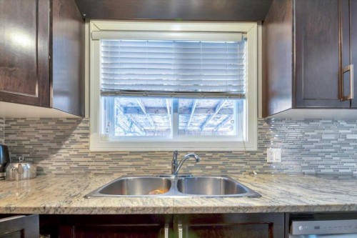 19 Castlepark Way Ne, Calgary, AB - Indoor Photo Showing Kitchen With Double Sink