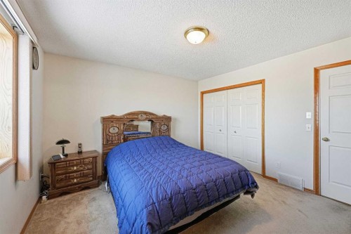 63 Anaheim Crescent Ne, Calgary, AB - Indoor Photo Showing Bedroom