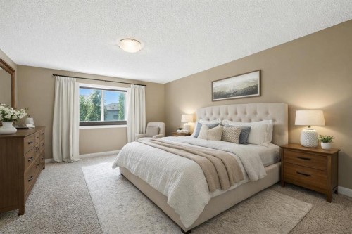 124 Kingsbridge Way Se, Airdrie, AB - Indoor Photo Showing Bedroom