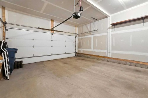 124 Kingsbridge Way Se, Airdrie, AB - Indoor Photo Showing Garage
