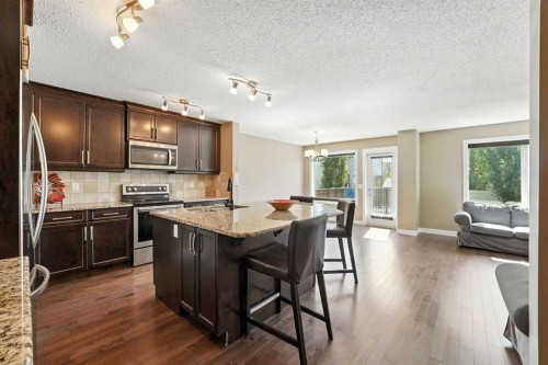 124 Kingsbridge Way Se, Airdrie, AB - Indoor Photo Showing Kitchen With Stainless Steel Kitchen With Upgraded Kitchen