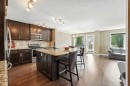 124 Kingsbridge Way Se, Airdrie, AB  - Indoor Photo Showing Kitchen With Stainless Steel Kitchen With Upgraded Kitchen 
