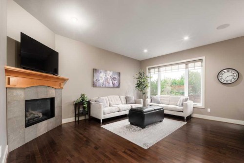 24 Aspen Meadows Green Sw, Calgary, AB - Indoor Photo Showing Living Room With Fireplace