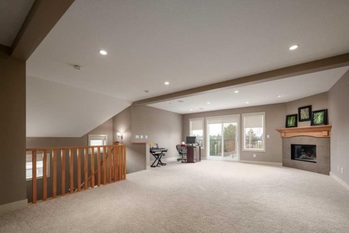 24 Aspen Meadows Green Sw, Calgary, AB - Indoor With Fireplace
