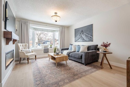 531 Deerpath Court Se, Calgary, AB - Indoor Photo Showing Living Room With Fireplace
