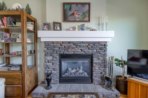 158 Fireside Bend, Cochrane, AB - Indoor Photo Showing Living Room With Fireplace
