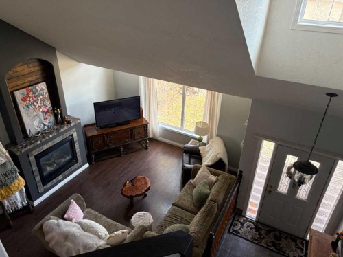 917 6 Avenue, Wainwright, AB - Indoor Photo Showing Living Room With Fireplace