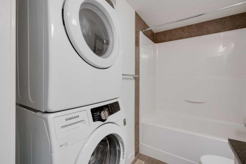 131 Cranford Walk Se, Calgary, AB - Indoor Photo Showing Laundry Room