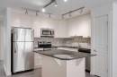 131 Cranford Walk Se, Calgary, AB  - Indoor Photo Showing Kitchen With Stainless Steel Kitchen With Upgraded Kitchen 