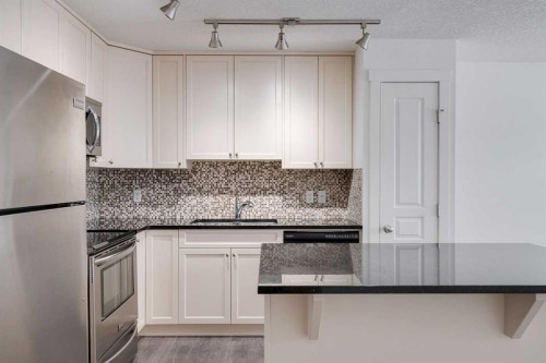131 Cranford Walk Se, Calgary, AB - Indoor Photo Showing Kitchen With Upgraded Kitchen