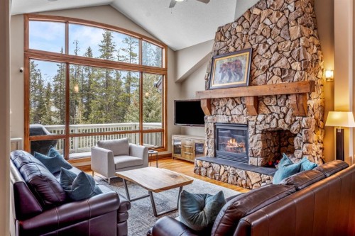 282 Miskow Close, Canmore, AB - Indoor Photo Showing Living Room With Fireplace