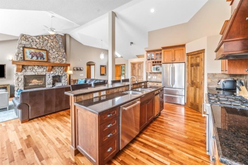 282 Miskow Close, Canmore, AB - Indoor Photo Showing Kitchen With Fireplace With Double Sink