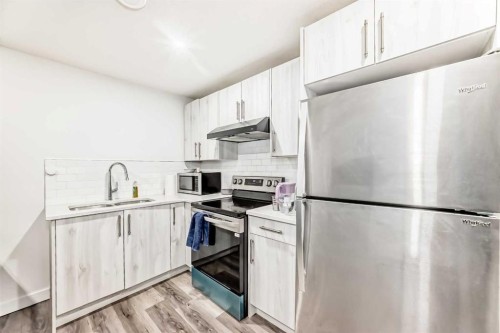 15021 1 Street Nw, Calgary, AB - Indoor Photo Showing Kitchen With Stainless Steel Kitchen With Double Sink