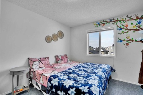 141 Saddlecrest Close Ne, Calgary, AB - Indoor Photo Showing Bedroom