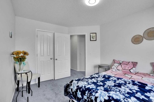 141 Saddlecrest Close Ne, Calgary, AB - Indoor Photo Showing Bedroom