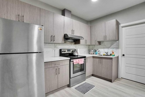 141 Saddlecrest Close Ne, Calgary, AB - Indoor Photo Showing Kitchen With Stainless Steel Kitchen