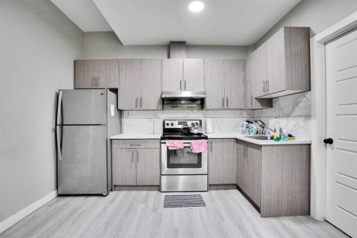 141 Saddlecrest Close Ne, Calgary, AB - Indoor Photo Showing Kitchen With Stainless Steel Kitchen