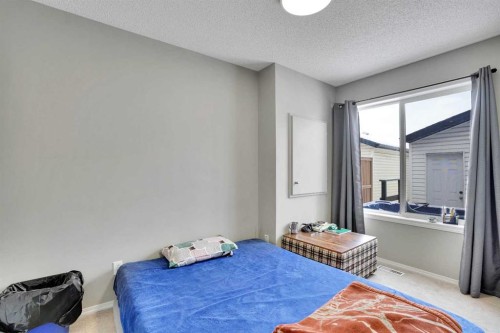 141 Saddlecrest Close Ne, Calgary, AB - Indoor Photo Showing Bedroom