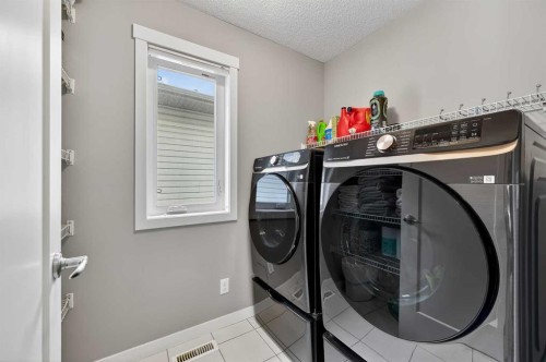24 Walden Mount Se, Calgary, AB - Indoor Photo Showing Laundry Room