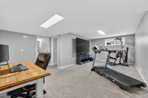 24 Walden Mount Se, Calgary, AB - Indoor Photo Showing Gym Room