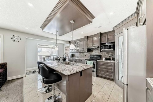 181 Saddlefield Place Ne, Calgary, AB - Indoor Photo Showing Kitchen With Stainless Steel Kitchen With Double Sink With Upgraded Kitchen