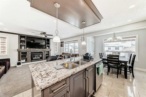181 Saddlefield Place Ne, Calgary, AB - Indoor Photo Showing Kitchen With Fireplace With Double Sink