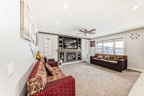 181 Saddlefield Place Ne, Calgary, AB - Indoor Photo Showing Living Room With Fireplace