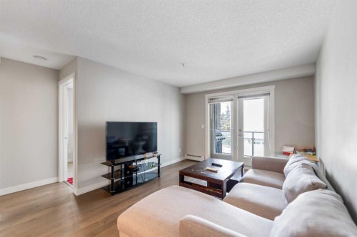201-2300 Evanston Square Nw, Calgary, AB - Indoor Photo Showing Living Room