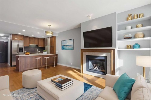 521-222 Riverfront Avenue Sw, Calgary, AB - Indoor Photo Showing Living Room With Fireplace
