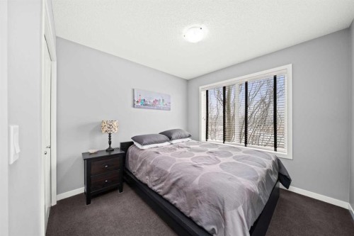 15 Copperpond Landing Se, Calgary, AB - Indoor Photo Showing Bedroom