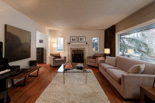 504 Crescent Boulevard Sw, Calgary, AB - Indoor Photo Showing Living Room With Fireplace