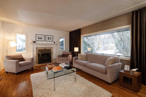 504 Crescent Boulevard Sw, Calgary, AB - Indoor Photo Showing Living Room With Fireplace