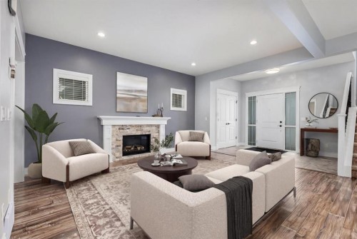 2144 Reunion Square, Airdrie, AB - Indoor Photo Showing Living Room With Fireplace
