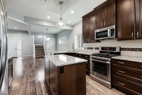 2144 Reunion Square, Airdrie, AB - Indoor Photo Showing Kitchen With Stainless Steel Kitchen