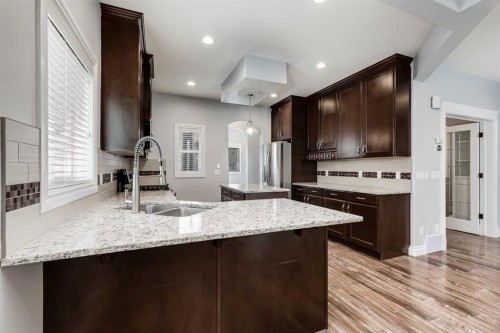 2144 Reunion Square, Airdrie, AB - Indoor Photo Showing Kitchen With Double Sink With Upgraded Kitchen